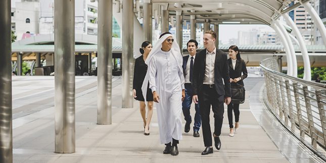 Business partners team walking down and discussing work. RFP is just Beginning. Know your Business Requirements in the GCC